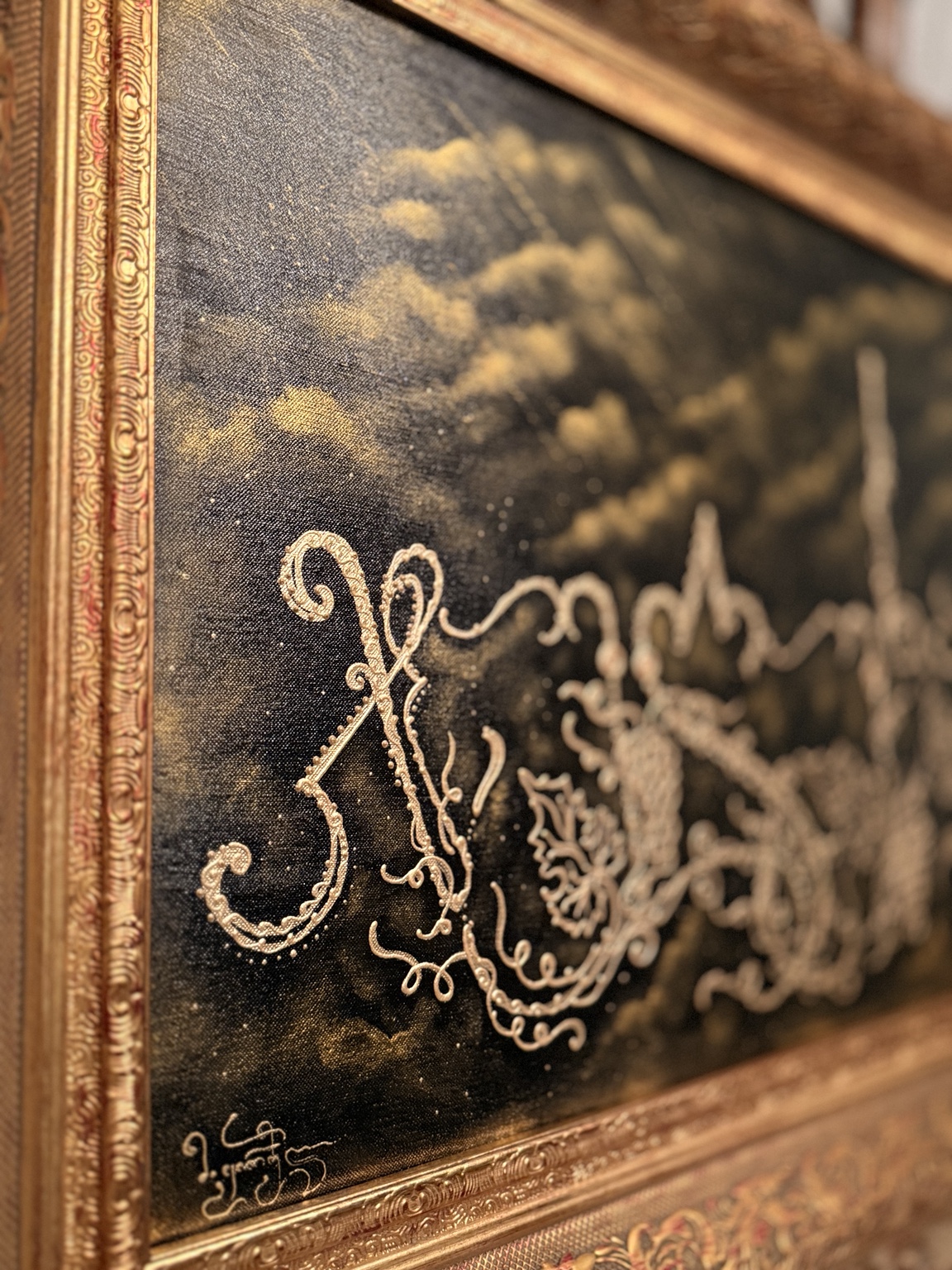 Close detail of framed gold calligraphy
